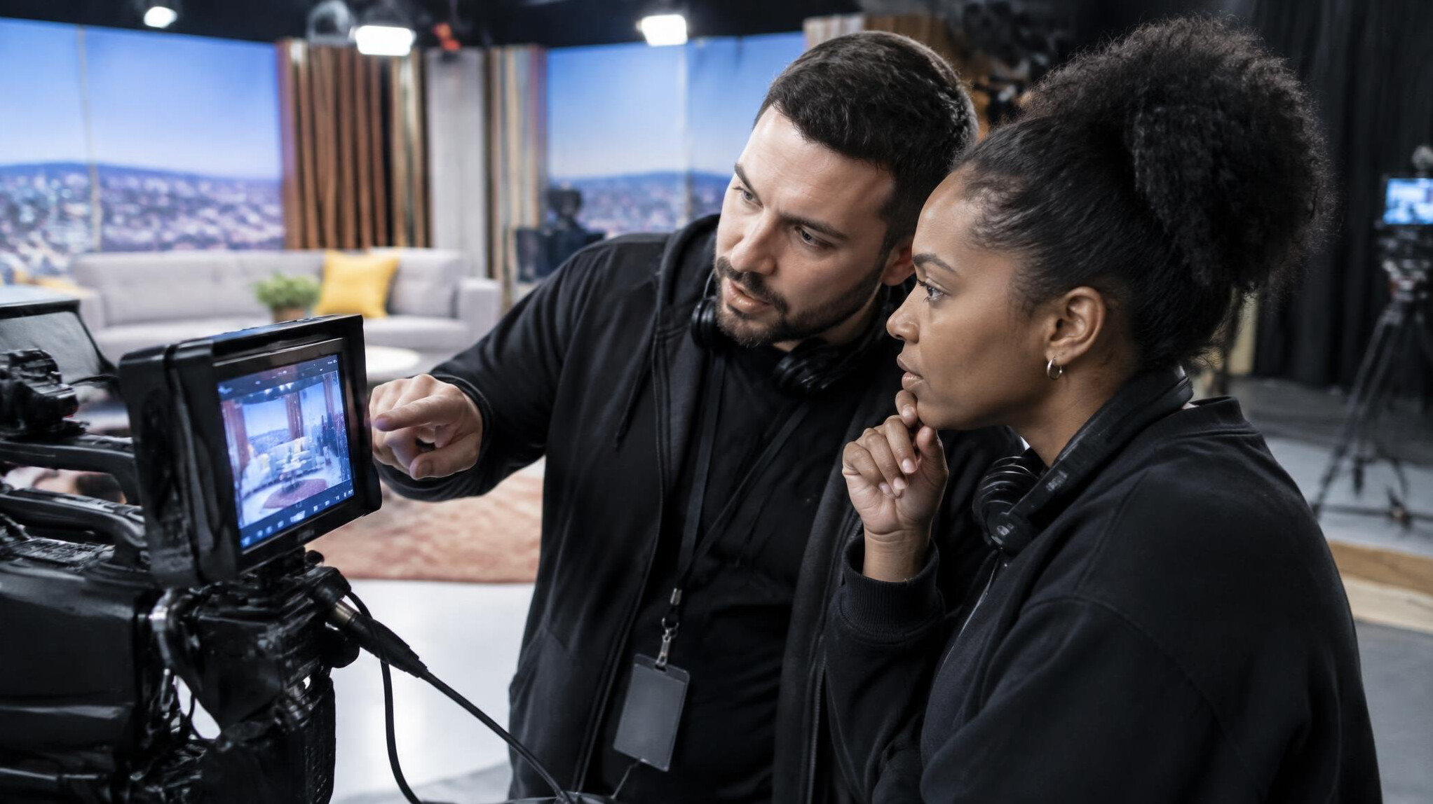 Broadcast crew reviewing a shot on a camera monitor